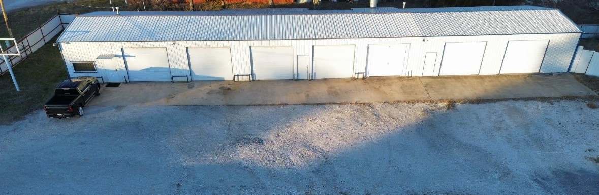 Broadway Precision Collision shop - long multi-bay auto body building in Ada, Oklahoma